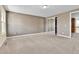 Bedroom with neutral carpet, double closet, and a bright window at 14204 E Radcliff Cir, Aurora, CO 80015