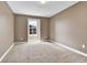 Neutral bedroom featuring a cozy carpet, fresh paint, and a window providing natural light at 14204 E Radcliff Cir, Aurora, CO 80015