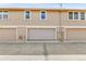 Townhome exterior featuring a set of garages, offering convenience and privacy at 14204 E Radcliff Cir, Aurora, CO 80015