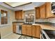 This kitchen is bathed in natural light and features stainless steel appliances at 14204 E Radcliff Cir, Aurora, CO 80015