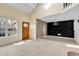 Bright open-concept living room with hardwood floors, front door and modern accents at 14204 E Radcliff Cir, Aurora, CO 80015