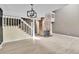 Bright living room with hardwood floors, brick fireplace, and open staircase at 14204 E Radcliff Cir, Aurora, CO 80015
