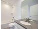 Cozy bathroom featuring tub-shower combination, white subway tile, and vanity at 4652 Windmill Dr, Brighton, CO 80601