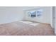 Bright bedroom with lots of natural light and neutral carpeting at 4652 Windmill Dr, Brighton, CO 80601