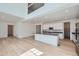 Open concept kitchen with a center island, modern appliances, and sleek cabinetry at 4652 Windmill Dr, Brighton, CO 80601