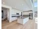 Contemporary kitchen with stainless appliances, island, and an open layout at 4652 Windmill Dr, Brighton, CO 80601