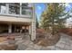 Tranquil backyard featuring a hot tub, patio, and lush landscaping, perfect for enjoying the outdoors at 65 Royal Ann Dr, Englewood, CO 80111
