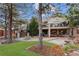 Serene backyard featuring a patio, fire pit, and mature trees, perfect for relaxation and outdoor activities at 65 Royal Ann Dr, Englewood, CO 80111