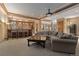 Finished basement features a bar area and large seating area for entertaining at 65 Royal Ann Dr, Englewood, CO 80111