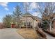 Charming stone home with landscaped yard and a spacious driveway at 65 Royal Ann Dr, Englewood, CO 80111