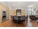 Open kitchen featuring a large island with seating and modern lighting at 65 Royal Ann Dr, Englewood, CO 80111
