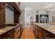 Gourmet kitchen with stainless appliances, granite countertops, and wood floors at 65 Royal Ann Dr, Englewood, CO 80111