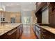 Kitchen featuring granite counters, stainless appliances, and hardwood floors at 65 Royal Ann Dr, Englewood, CO 80111