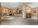 Large living room area is equipped with a home theatre, wet bar, and ample space for entertaining at 65 Royal Ann Dr, Englewood, CO 80111