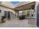 Covered patio boasts a built-in bar, outdoor seating, and a mounted TV for entertainment at 65 Royal Ann Dr, Englewood, CO 80111