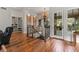 Staircase leading to upper level with chandelier, wood floors, and built-in shelves at 65 Royal Ann Dr, Englewood, CO 80111