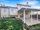 Spacious backyard with a covered patio, ideal for outdoor entertaining and relaxation at 2875 S Espana Ct, Aurora, CO 80013