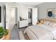 Cozy bedroom features a comfortable queen-sized bed and ample closet space at 2875 S Espana Ct, Aurora, CO 80013