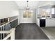 Dining area features carpeted floor, modern lighting, and a large window at 2875 S Espana Ct, Aurora, CO 80013