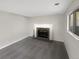 Living room with fireplace and a large window providing natural light at 2875 S Espana Ct, Aurora, CO 80013