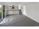 Open-concept living area featuring access to kitchen, backyard, and upper floor at 2875 S Espana Ct, Aurora, CO 80013