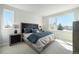 Comfortable bedroom featuring large windows, plush carpet, and serene decor at 888 S Valentia St # 104, Denver, CO 80247