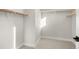 Spacious walk-in closet featuring ample shelving and wooden rods at 888 S Valentia St # 104, Denver, CO 80247