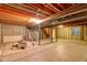 Spacious unfinished basement with utility connections and exposed ceiling at 10320 E Jewell Ave # 63, Aurora, CO 80247
