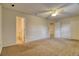 A cozy bedroom with a ceiling fan and a bathroom entrance that offers an ideal space for relaxation at 10320 E Jewell Ave # 63, Aurora, CO 80247