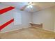 Bedroom features plush carpet, built-in desk, and good natural light from window at 10320 E Jewell Ave # 63, Aurora, CO 80247