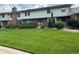 Charming townhomes with brick facades, well-maintained lawns, and mature landscaping at 10320 E Jewell Ave # 63, Aurora, CO 80247