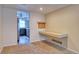 Neutral flex room with built-in desk adjacent to the kitchen area at 10320 E Jewell Ave # 63, Aurora, CO 80247