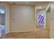 Spacious hallway with neutral color, carpeted floor and an inviting view of connecting rooms at 10320 E Jewell Ave # 63, Aurora, CO 80247