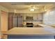 Bright kitchen featuring gray cabinets, stainless appliances, and expansive countertops at 10320 E Jewell Ave # 63, Aurora, CO 80247