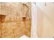 Updated tile shower with rainfall showerhead and corner shelves at 10320 E Jewell Ave # 63, Aurora, CO 80247