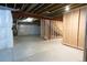 This basement features visible ceiling beams, framed rooms, and wrapped pillars and beams at 8791 Culebra Ct, Arvada, CO 80007