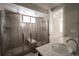 Beautiful bathroom featuring a frameless shower and marble countertops at 8791 Culebra Ct, Arvada, CO 80007