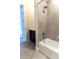 This bathroom is equipped with shower over tub, tiled walls and floor and dark cabinets at 8791 Culebra Ct, Arvada, CO 80007