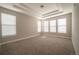 Bright bedroom with neutral carpet, large windows, and recessed lighting at 8791 Culebra Ct, Arvada, CO 80007