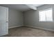 Bedroom featuring plush carpeting, neutral paint, a window, and a walk-in closet at 8791 Culebra Ct, Arvada, CO 80007