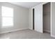 Carpeted bedroom with closet and a bright window at 8791 Culebra Ct, Arvada, CO 80007