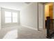 Spacious bedroom with neutral tones, bright light, and easy access to bathroom at 8791 Culebra Ct, Arvada, CO 80007