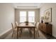 Classic dining room featuring a wooden table, seating for six, and elegant décor at 8791 Culebra Ct, Arvada, CO 80007