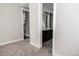 Hallway view of bedroom and en-suite bathroom with double vanity at 8791 Culebra Ct, Arvada, CO 80007