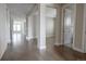Spacious open-concept hallway with hardwood floors and abundant natural light at 8791 Culebra Ct, Arvada, CO 80007