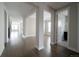 Spacious open-concept hallway with hardwood floors and abundant natural light at 8791 Culebra Ct, Arvada, CO 80007