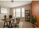 Bright home office with stylish desk, shelving, and plenty of natural light at 8791 Culebra Ct, Arvada, CO 80007