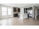 Well-lit kitchen featuring stainless appliances, an island with seating, and stylish dark cabinetry at 8791 Culebra Ct, Arvada, CO 80007