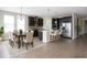 Open kitchen with modern stainless steel appliances and an island with bar seating at 8791 Culebra Ct, Arvada, CO 80007