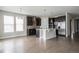 Modern kitchen featuring stainless steel appliances, a large island, and an open floor plan at 8791 Culebra Ct, Arvada, CO 80007